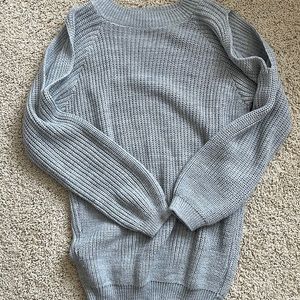 Women’s gray open shoulder sweater.